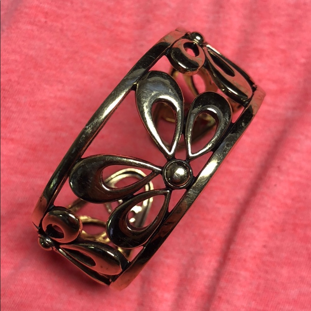 Gold colored bracelet.